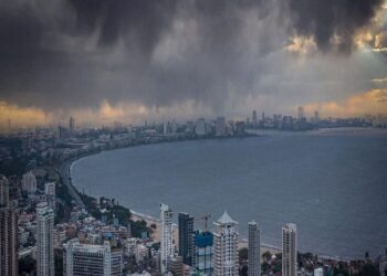 An orange alert for a grey and wet city