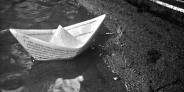 Paper boats with messages