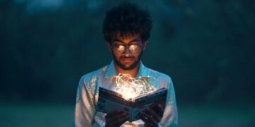 An individual diving deep within a book, seeking knowledge.