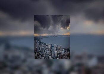 An orange alert for a grey and wet city
