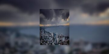 An orange alert for a grey and wet city